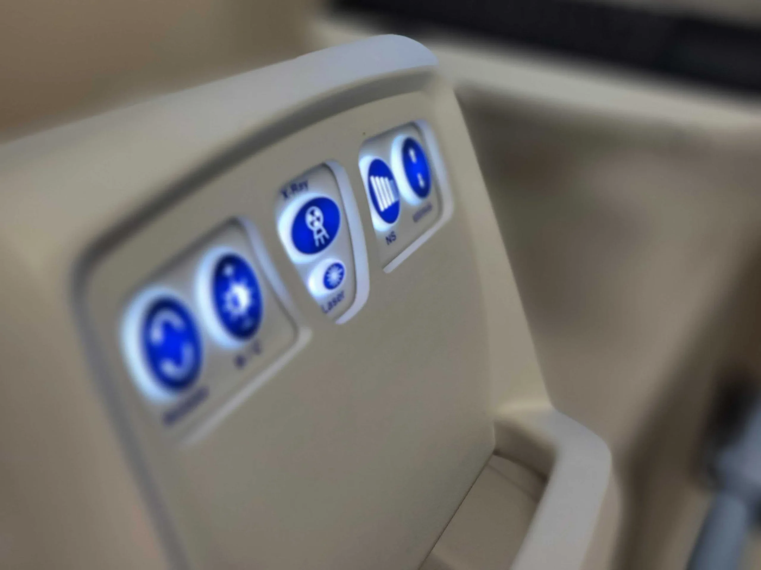 close up of a medical device with a tv in the background