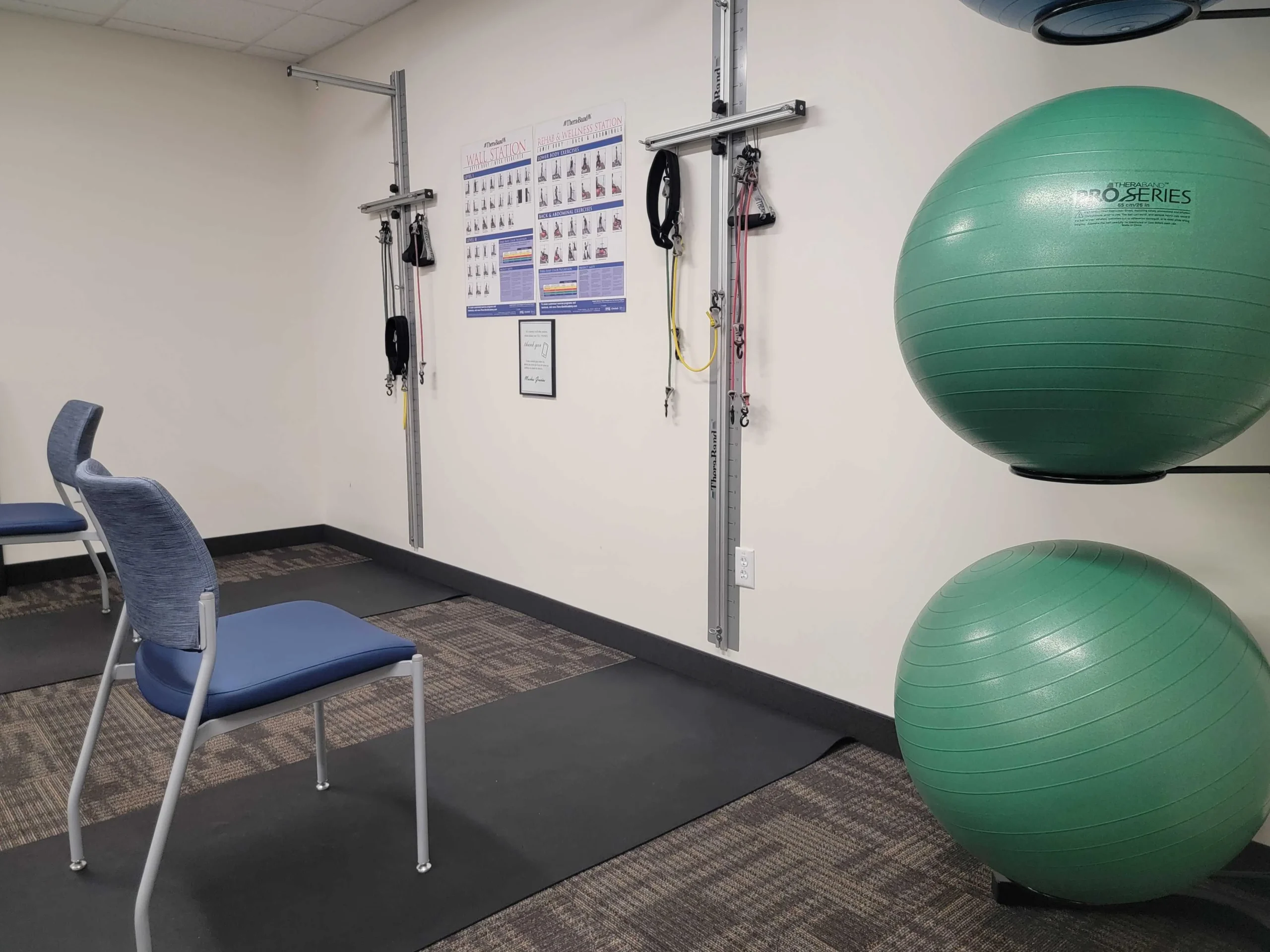 room with exercise balls and a chair