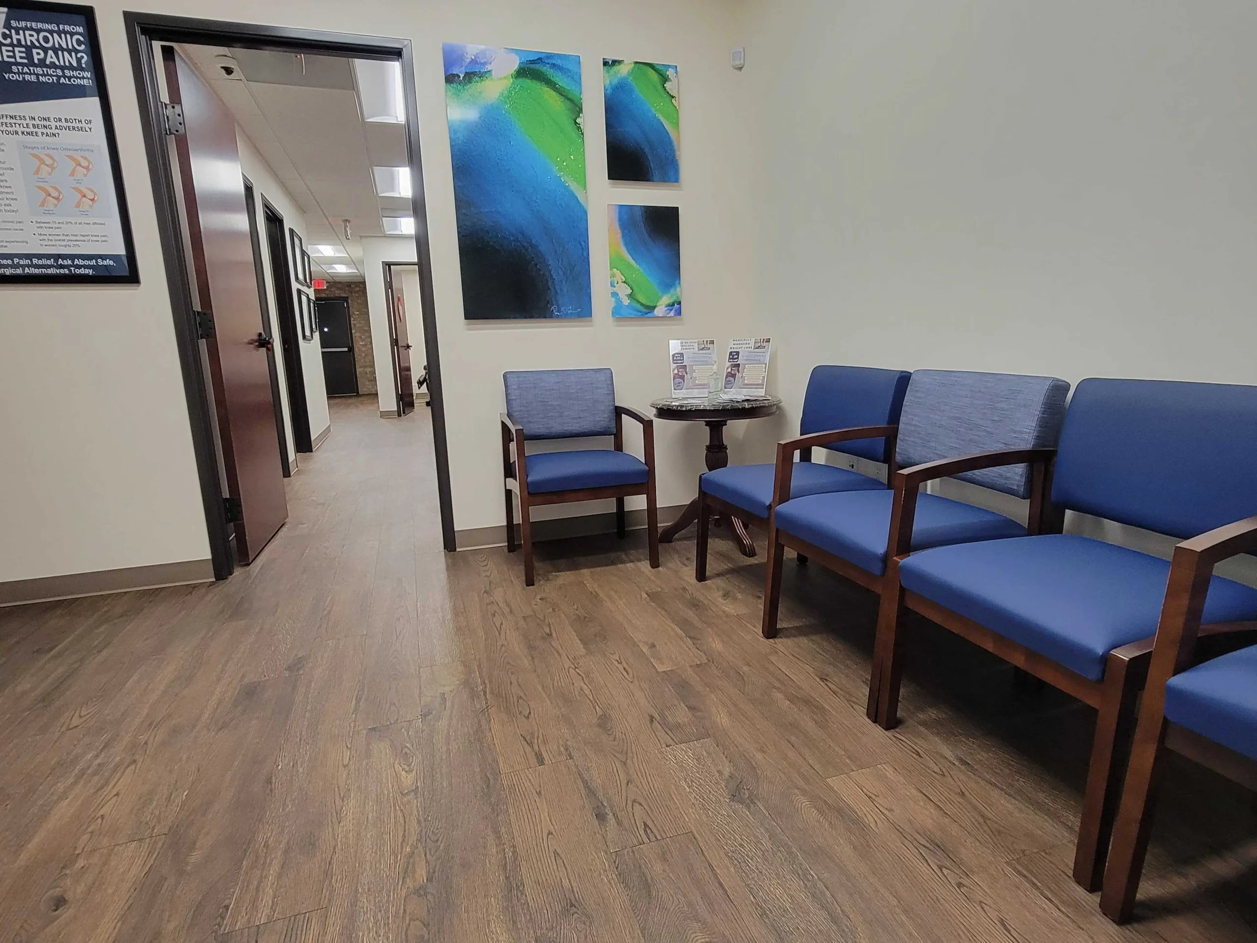 waiting room with blue chairs in it